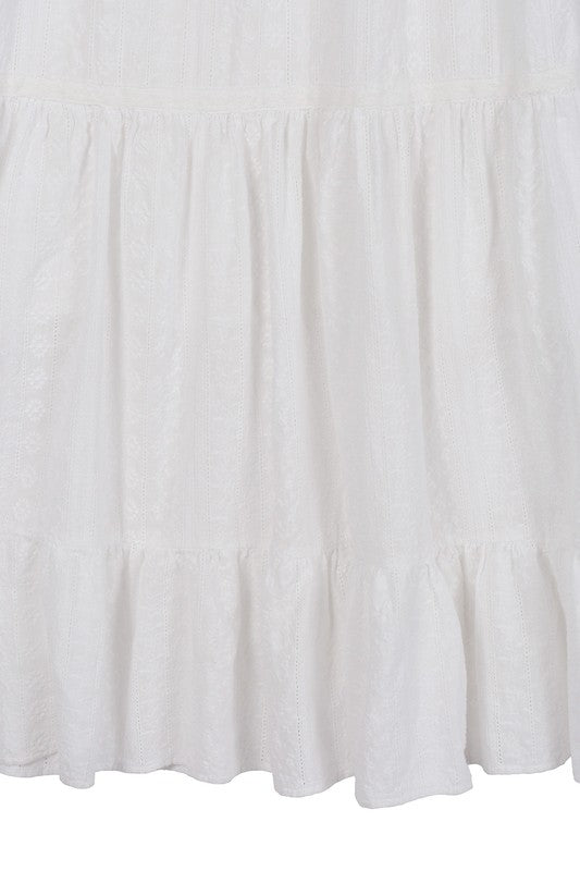 Embroidered white V neckline tiered dress